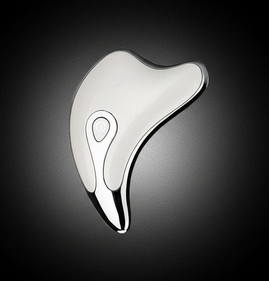 modern silver facial gua sha tool with power button on white background
