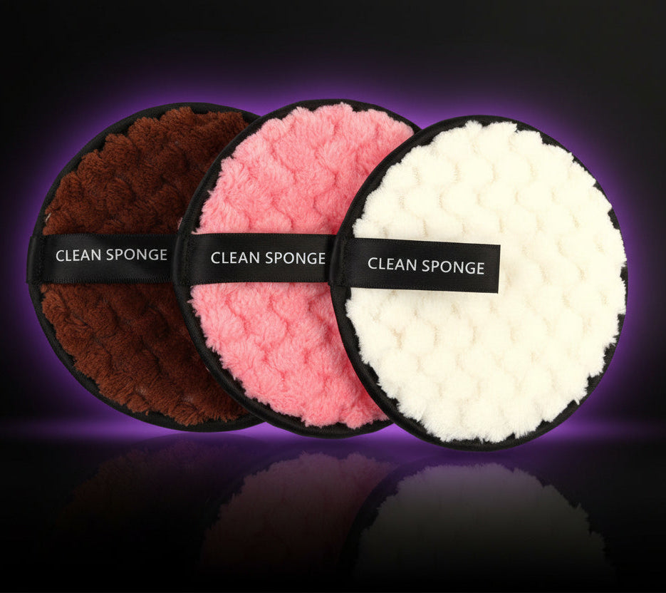 Set of three round soft cleaning sponges in brown, pink, and white with black trim and strap