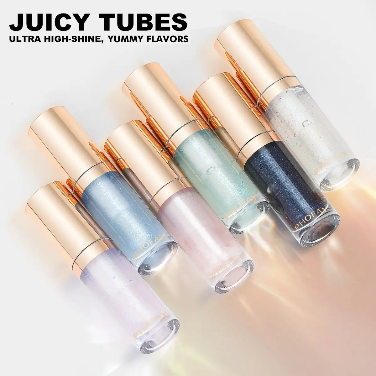 Set of lip gloss tubes with gold caps on a gradient background, featuring the brand 'Juicy Tubes'.