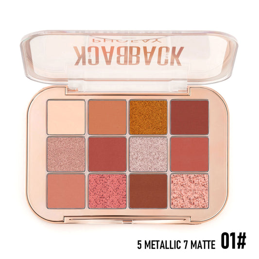 Makeup palette with various shades of eyeshadow in metallic and matte finishes, branded.