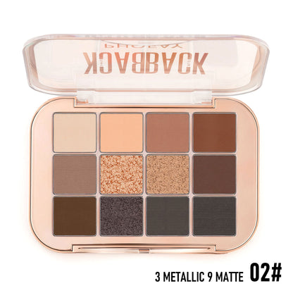 Makeup palette with various shades of eyeshadows on a white background