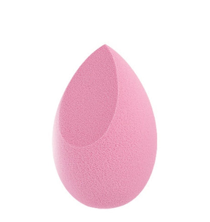 Pink teardrop makeup sponge blender with flat edge on white background