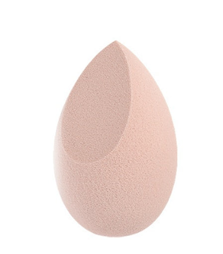 Light pink makeup blending sponge with a unique angled cut for precise application