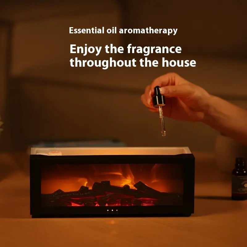 Hand using a dropper over an electric fireplace with text about essential oil aromatherapy.