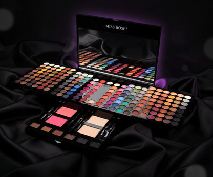Miss Rose makeup palette with colorful eyeshadows, blushes, powders, brushes, and mirror